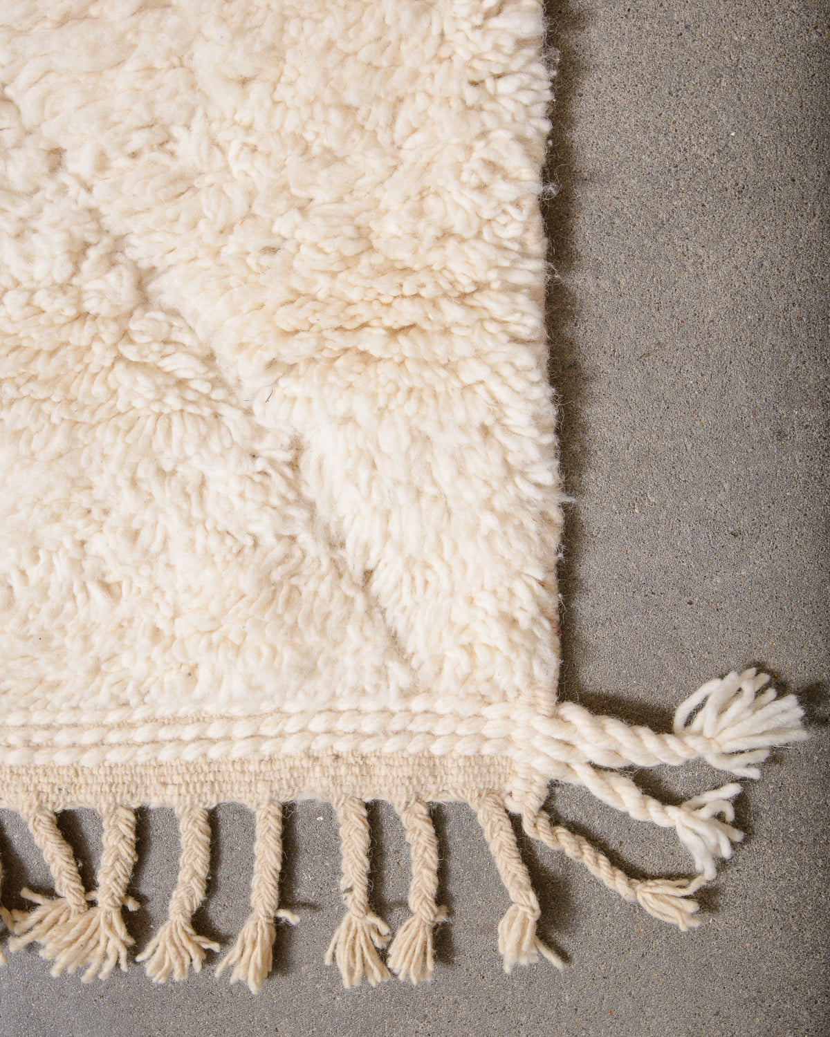 Modern, designer, handcrafted Berber rug from Morocco. Beniourain carpet with minimalist design, natural wool pile and a fluffy texture.